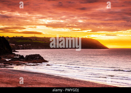 Sunset over the beach at Tresaith in Ceredigion, Wales, looking towards Aberporth. Stock Photo