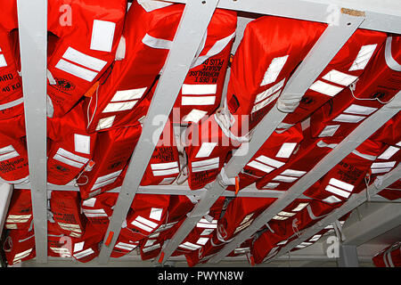 Life jackets in a storage place Stock Photo