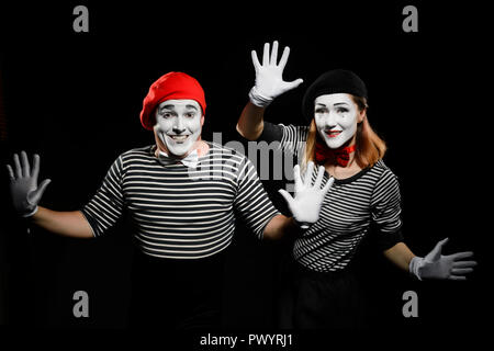 Two mimes touching invisible wall Stock Photo