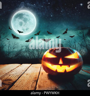 Halloween Scene - Jack Lanterns Glowing At Moonlight In The Spooky Night Stock Photo