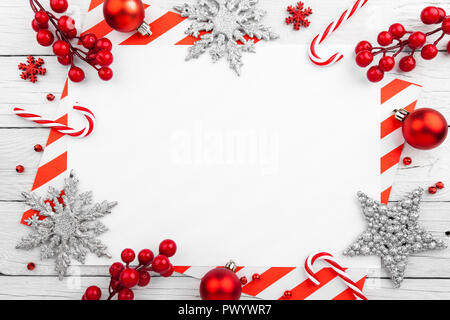 Red christmas frame with stars, snowflakes and candies Stock Photo