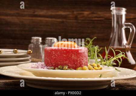 Beef steak tatare with egg, onion, cucumber and capers Stock Photo