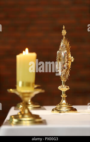 Monstrance for worship at a Catholic church ceremony with empty space for text Stock Photo