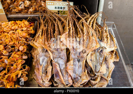 Dried squids on market stall in Hong Kong Stock Photo