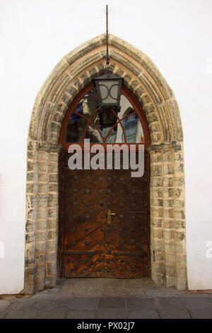 Estonia, Tallinn, Historical centre built within medieval defensive walls. UNESCO World Heritage Site. Intricate old iron studded wooden door. Stock Photo