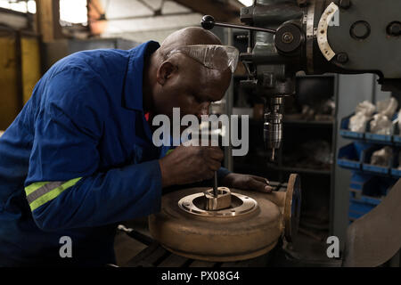 Blacksmith working in workshop Stock Photo
