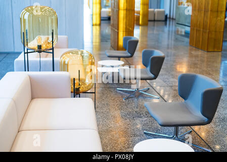 Office waiting area interior with white sofas Stock Photo