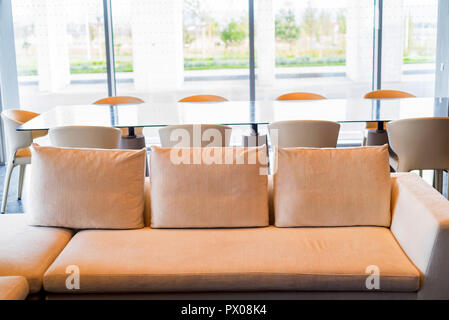Office waiting area interior with white sofa and table Stock Photo