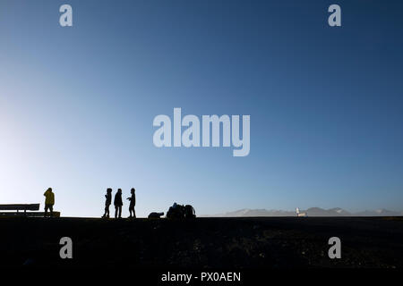 Hitchhikers waiting on the Iceland ring road route 1 in Iceland Stock Photo