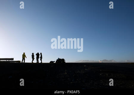 Silhouette hitchhikers waiting on the Iceland ring road route 1 in Iceland Stock Photo