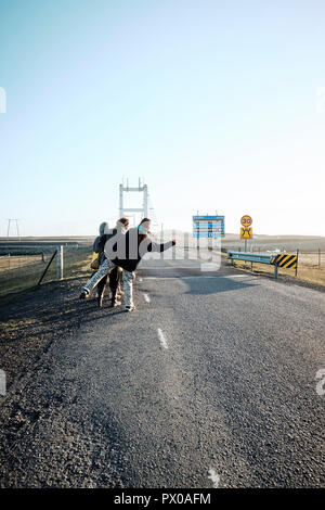 Hitchhikers waiting on the Iceland ring road route 1 in Iceland Stock Photo