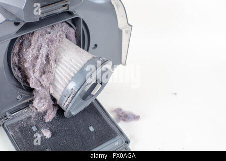 Common household dust on HEPA (High efficiency particulate air) filter from the vacuum cleaner. high angle view, isolated on a white background Stock Photo
