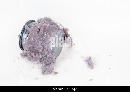 Common household dust on HEPA (High efficiency particulate air) filter from the vacuum cleaner. high angle view, isolated on a white background Stock Photo