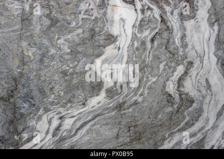 Gray surface of marble stone with striped streaks. Stock Photo