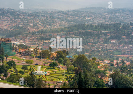 Kigali, Rwanda - September 21, 2018: A high angle view of the fountain roundabout near the city centre with rows of hills fading into the distance Stock Photo