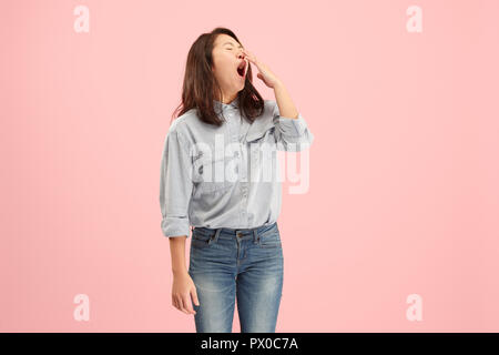 I am tired of everything. Bored woman. Boring, dull, tedious concept. Young pretty caucasian emotional woman. Human emotions, facial expression concept. Studio Isolated on trendy pink background Stock Photo