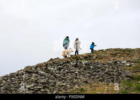 People walking on Loughcrew megalithic tomb