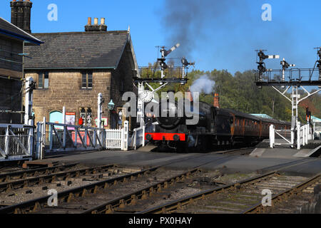 Passenger train leaving Grosmont Station, North Yorkshire Moors, on the NYMR line from Whitby to Pickering, U.K. Stock Photo