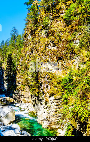 The turquoise waters of the Coquihalla River as it flows through the Coquihalla Canyon and the Othello Tunnels of the old Kettle Valley Railway in BC Stock Photo