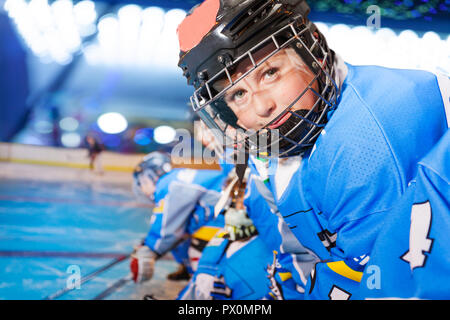 Portrait of happy boy in ice hockey uniform Stock Photo