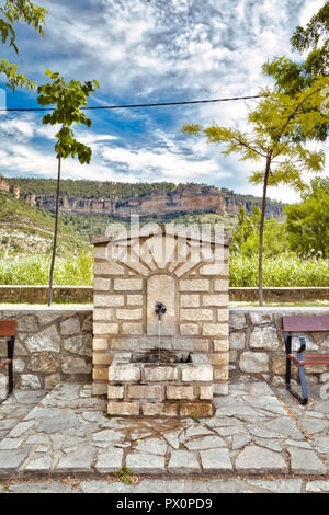 Ancient public fountain next to the Uña lagoon, in the province of Cuenca, Spain Stock Photo