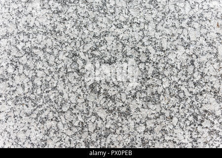 Textured surface of speckled grey granite rock Stock Photo