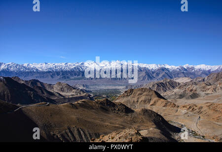 The Stok Range, with Stok Kangri (6123m) and Leh city, seen from the Khardung La Pass, Ladakh, India Stock Photo