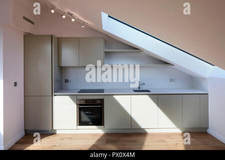 Open-plan kitchen, dining and living room in the iconic art deco Hoover Building in London, UK which has been converted into apartments by Interrobang Stock Photo