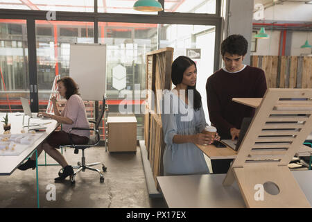 Executives working on laptop Stock Photo