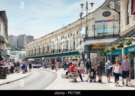 21 May 2018: Torquay, Devon, UK - Shopping in Fleet Street, with the Fleet Walk shopping mall, on a warm spring day. Stock Photo