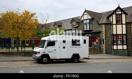 Loomis security cash collection van,Ambleside,Lake District,Cumbria,England,UK Stock Photo