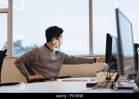 Businessman working on desktop pc Stock Photo