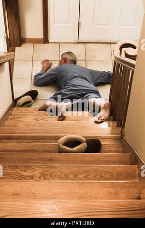 Senior man fallen on stairs in suburban home, USA Stock Photo - Alamy