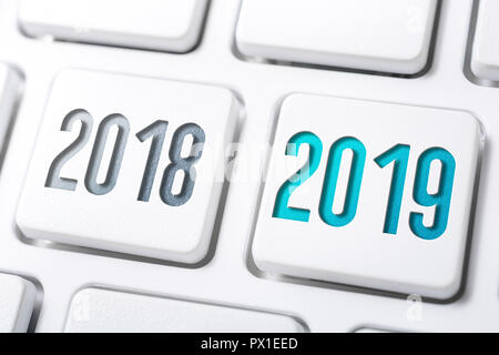 Macro Of 2 Buttons With The Year 2018 And 2019 On White Keyboard Stock Photo
