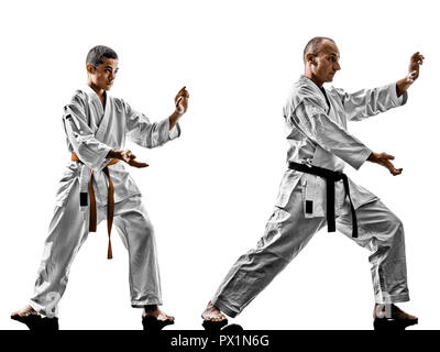 two karate men sensei and teenager student teacher teaching isolated on white background Stock Photo