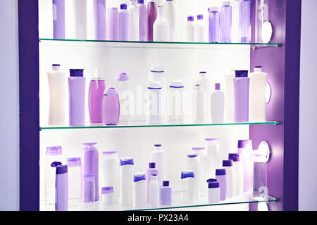 Showcase shop with plastic bottles and jars cosmetic and shampoo Stock Photo