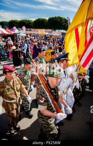 Carrying Vietnamese and American flags, an honor guard of former South Vietnamese soldiers marches at an Asian American cultural festival in Costa Mesa, CA. Stock Photo