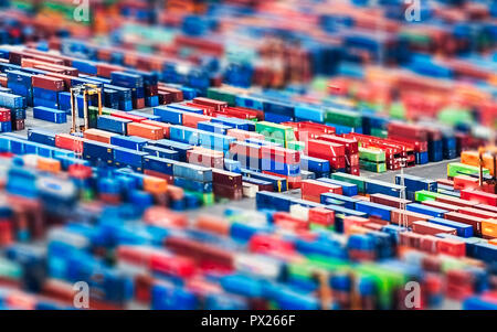 Texture made with an aerial view over shipping cargo containers stacked on a commercial port. Tilt-shift effect applied, suitable to be used as backgr Stock Photo