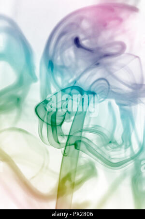 Abstract colorful smoke swirls on white background Stock Photo