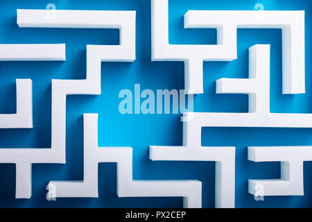 High Angle View Of White Maze On Blue Background Stock Photo