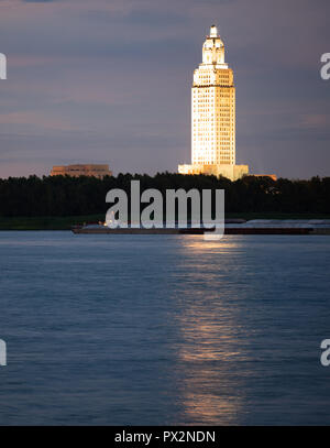 Vertical composition covering the Mississippi River waterfront barge traffic and the State Capitol of Louisiana at Baton Rouge Stock Photo