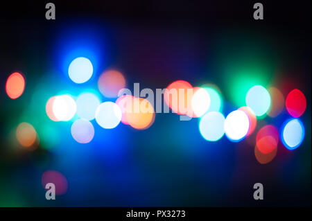Multicolor defocused bokeh lights in the night background Stock Photo