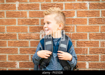 A Back to school. Happy little boy with backpack Stock Photo