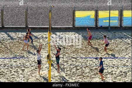 Brighton UK 19th October 2018 - Beach volleyball players enjoy the beautiful warm sunny weather at the Yellowave Centre on Brighton seafront today Credit: Simon Dack/Alamy Live News Stock Photo