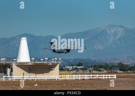 Los Alamitos, CA. USAF C-17 Globemaster III takes off through the heat waves on the runway at Joint Forces Training Base Los Alamintos for the Great Pacific Air Show on October, 19, 2018. Credit: Benjamin Ginsberg Credit: Benjamin Ginsberg/Alamy Live News Stock Photo