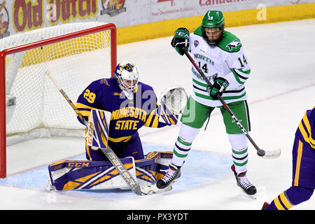 October 19, 2018 North Dakota Fighting Hawks forward Jasper Weatherby (14) redirects a shot in front of Minnesota State Mavericks goaltender Dryden McKay (29) during a NCAA men's college hockey game between the Minnesota State Mavericks and the University of North Dakota Fighting Hawks at Ralph Engelstad Arena in Grand Forks, ND Mankato won 7-4. Photo by Russell Hons/CSM Stock Photo