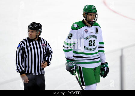 October 19, 2018 North Dakota Fighting Hawks forward Rhett Gardner (22) is escorted off the ice after receiving a major and game misconduct penalty for checking from behind during a NCAA men's college hockey game between the Minnesota State Mavericks and the University of North Dakota Fighting Hawks at Ralph Engelstad Arena in Grand Forks, ND Mankato won 7-4. Photo by Russell Hons/CSM Stock Photo