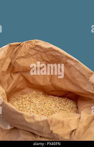 Oats in a paper bag. Stock Photo
