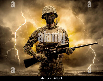 Armed soldier standing in rainy obscure weather  Stock Photo