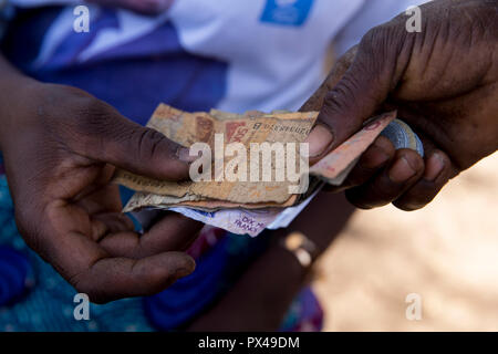 Microfinance loan reimbursement in Northern Togo. Stock Photo